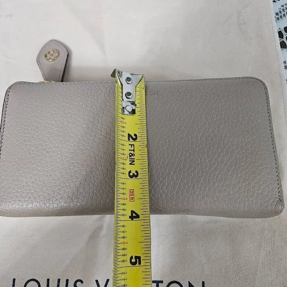Louis Vuitton Taurillon portefeuille Comete long zip wallet